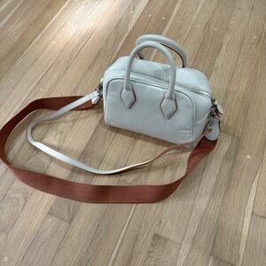 Elegant Cream Handbag with Tan Strap
